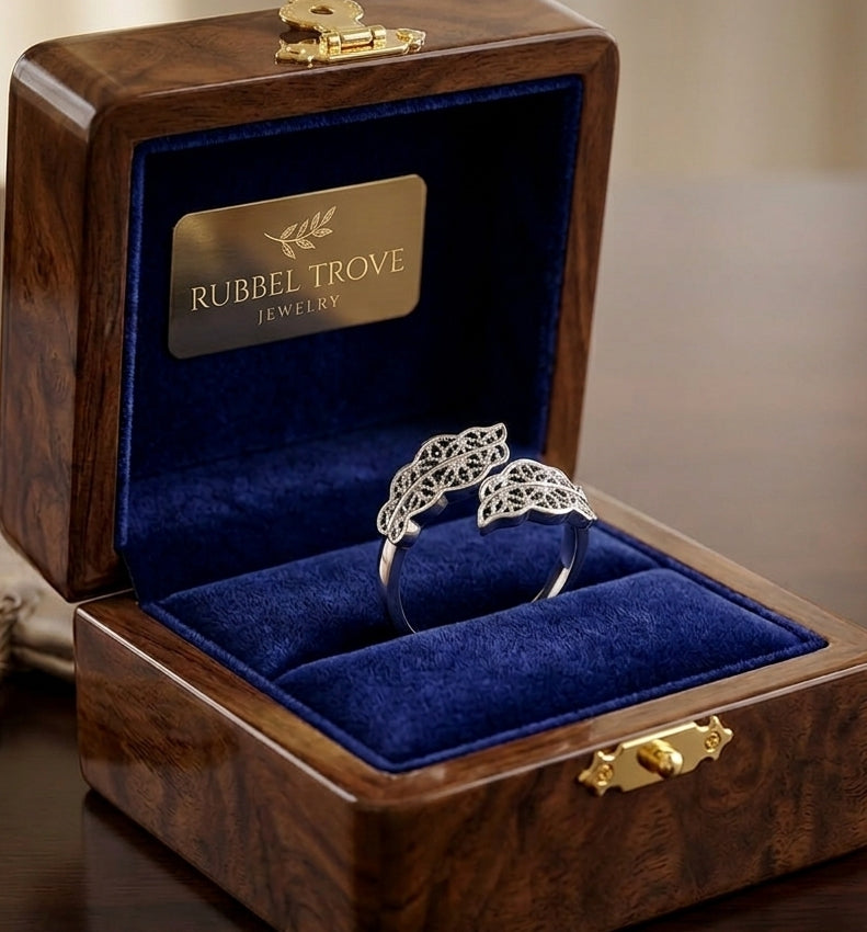 925 silver filigree leaf open ring on marble surface