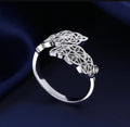Woman wearing adjustable silver leaf ring on finger