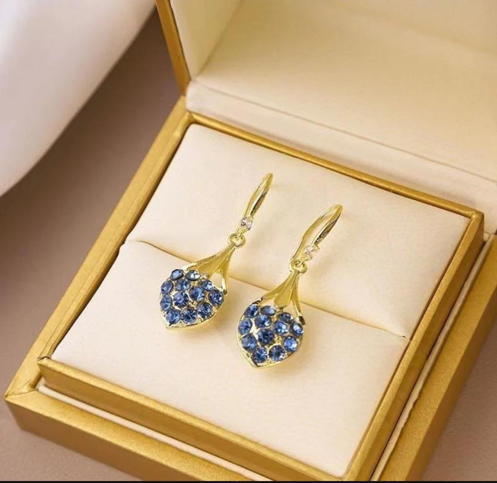 Blue crystal heart drop earrings gold tone in gold jewellery box packaging